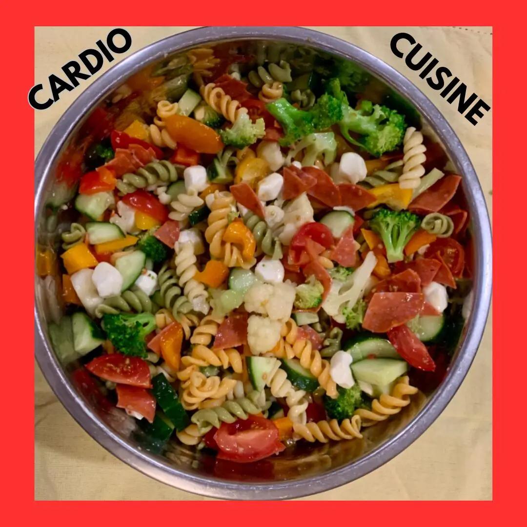 Colorful pasta salad with vegetables in a bowl.