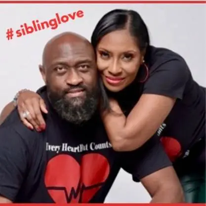 Two people smiling together showing sibling love.