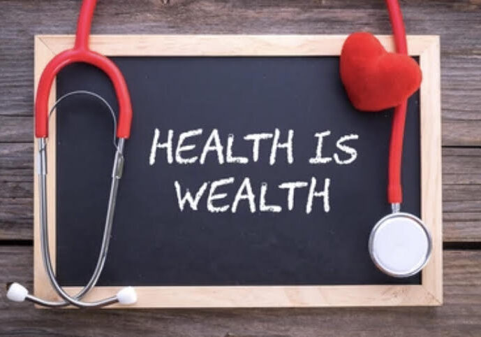 Chalkboard with 'Health is Wealth' and a red stethoscope.